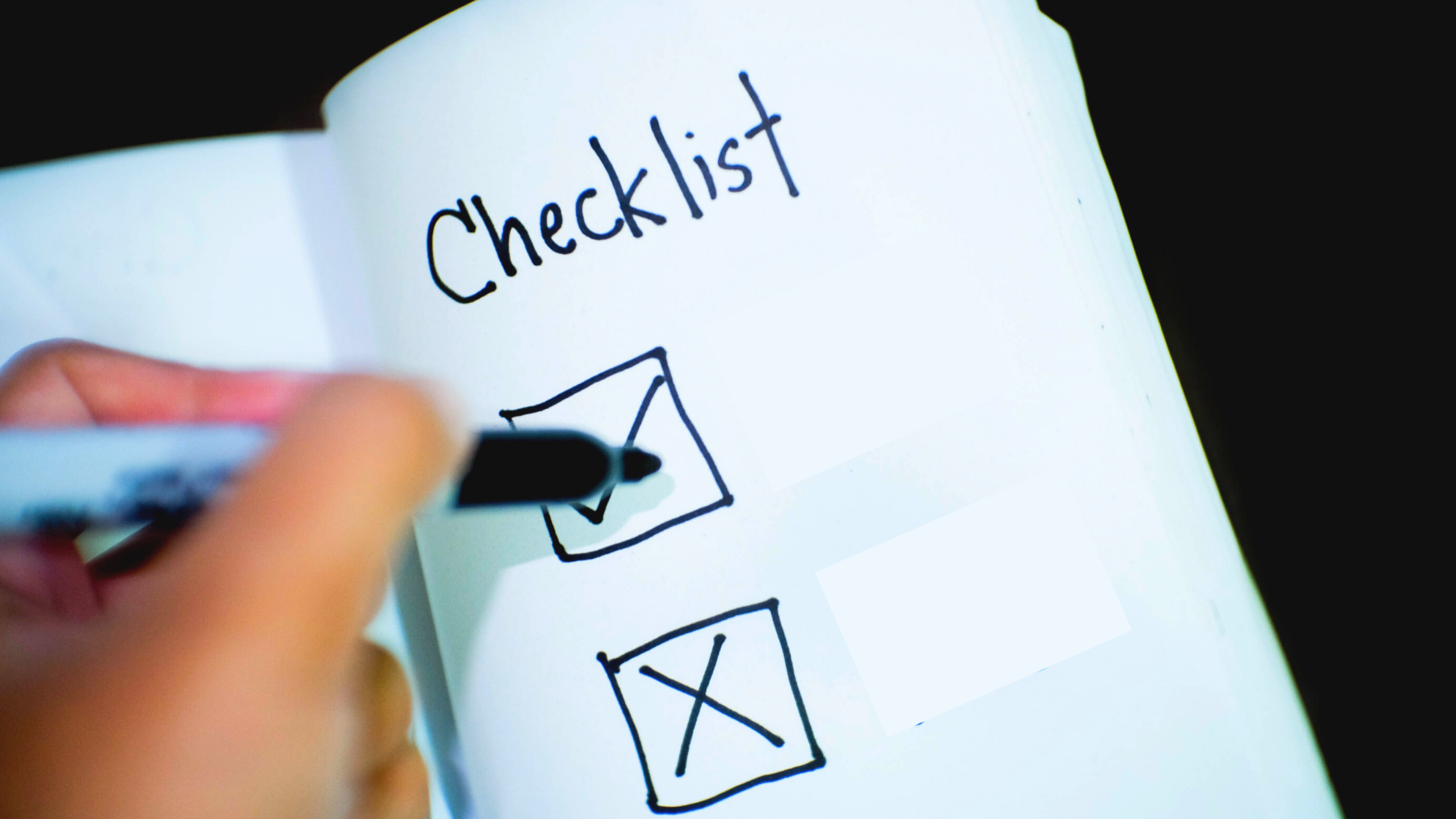 A person using a decluttering checklist to become clutter free