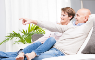 A couple relaxing together after downsizing and decluttering their home