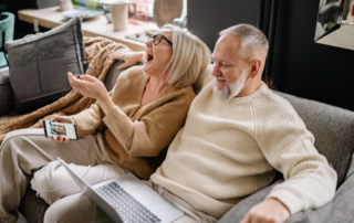 A couple in their 60s relaxing after decluttering and downsizing their home to age in place