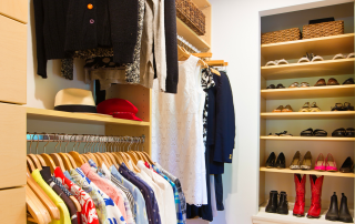 A bedroom closet that is organized and looked neat.