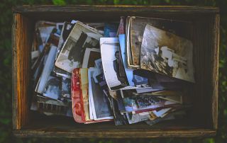 An image of a box full of old family photos.