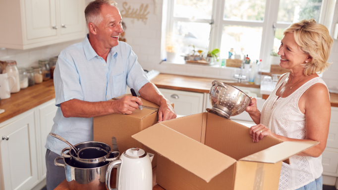 A middle-aged couple decluttering their stuff and downsizing their home.
