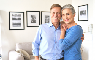 An image of happy couple living their new minimalist lifestyle.