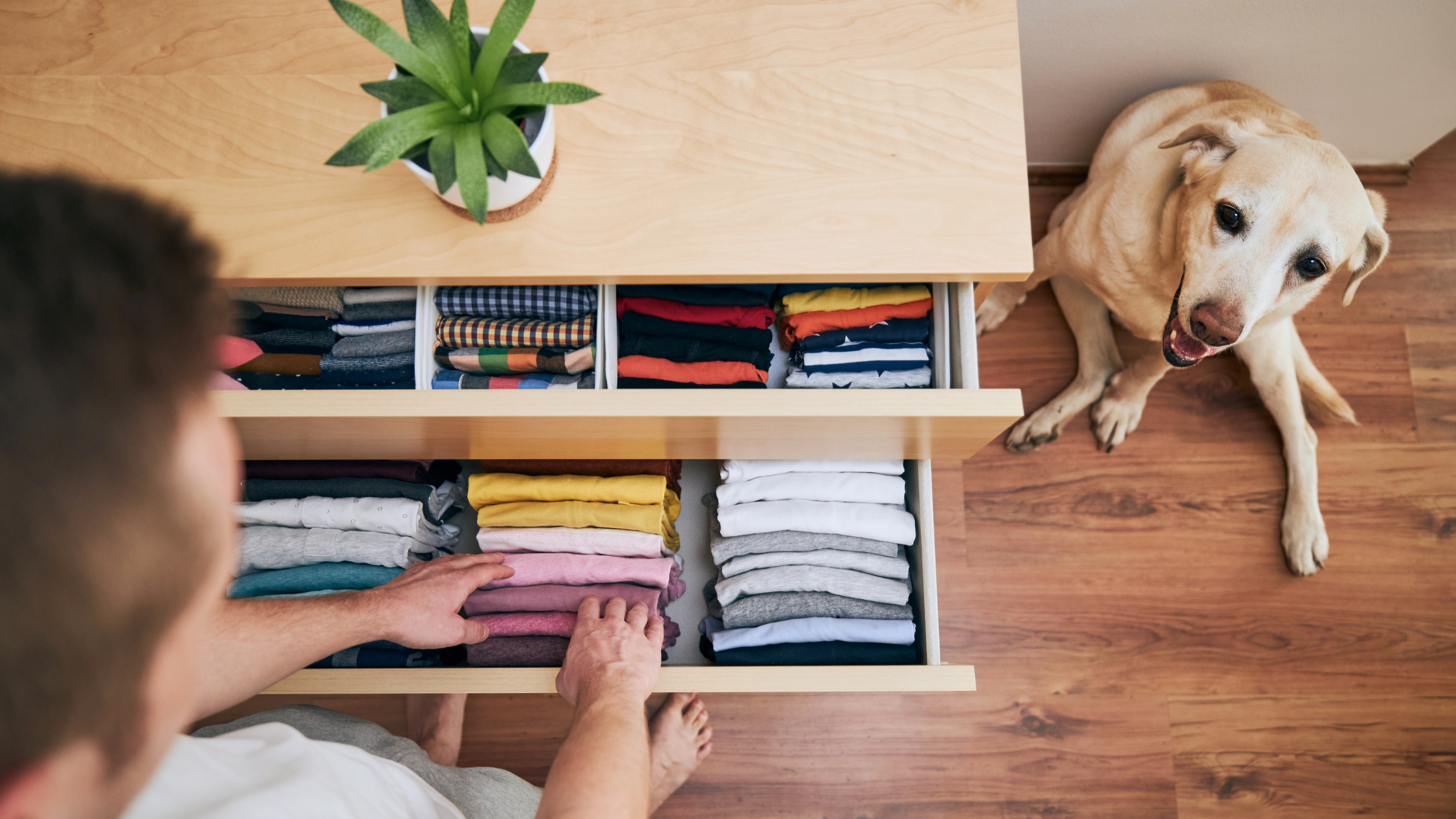 A man organizing and decluttering one drawer at a time.