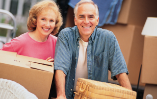 An image of a retired couple creating their minimalist home by moving to a new home and decluttering their excess stuff.