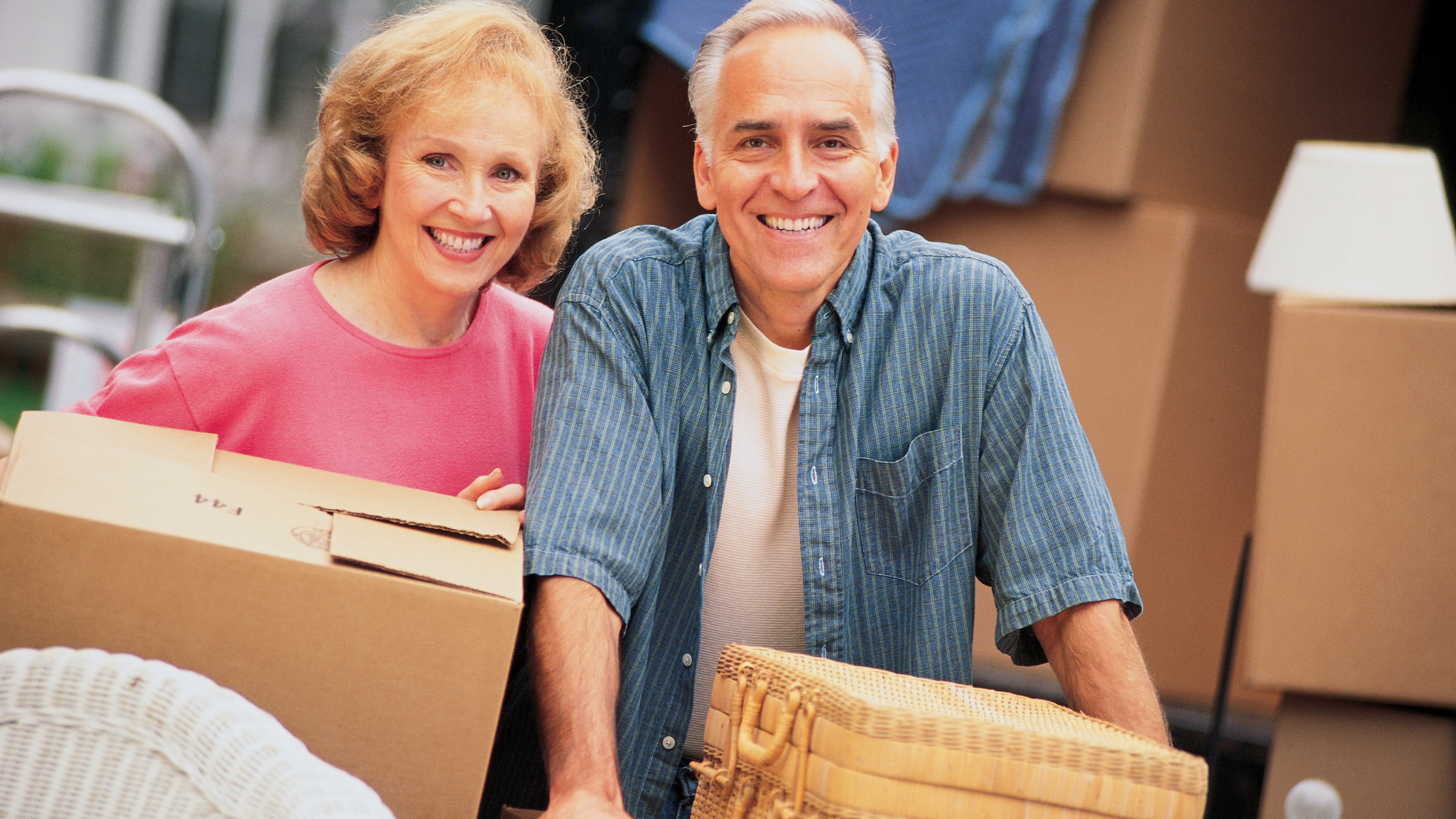 An image of a retired couple creating their minimalist home by moving to a new home and decluttering their excess stuff.