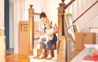 An image of a woman who is decluttering her parents stuff.