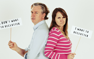 An image of a couple arguing about decluttering.