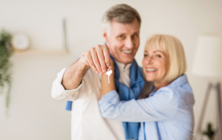 An image of a retired couple who just downsized to a smaller home that fits their lifestyle.