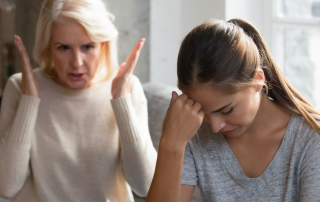 An image of a mother and daughter talking about their cluttered home.