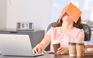 An image of a girl in fatigued by work.