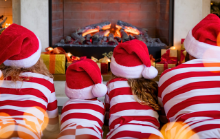 An image of a family looking at the fireplace with Christmas decor reimagining their holiday celebrations.
