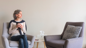 An image of a baby boomer woman who is scared to leave her things behind and the memories they have.