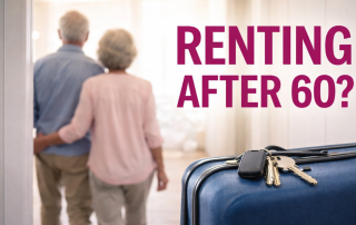 Senior couple entering a new home with suitcase and keys, representing renting in retirement after 60
